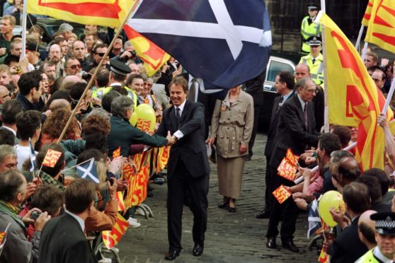 Tony Blair is greeted by crowds in Edinburgh in 1997 following the government's plan for a Scottish parliament.