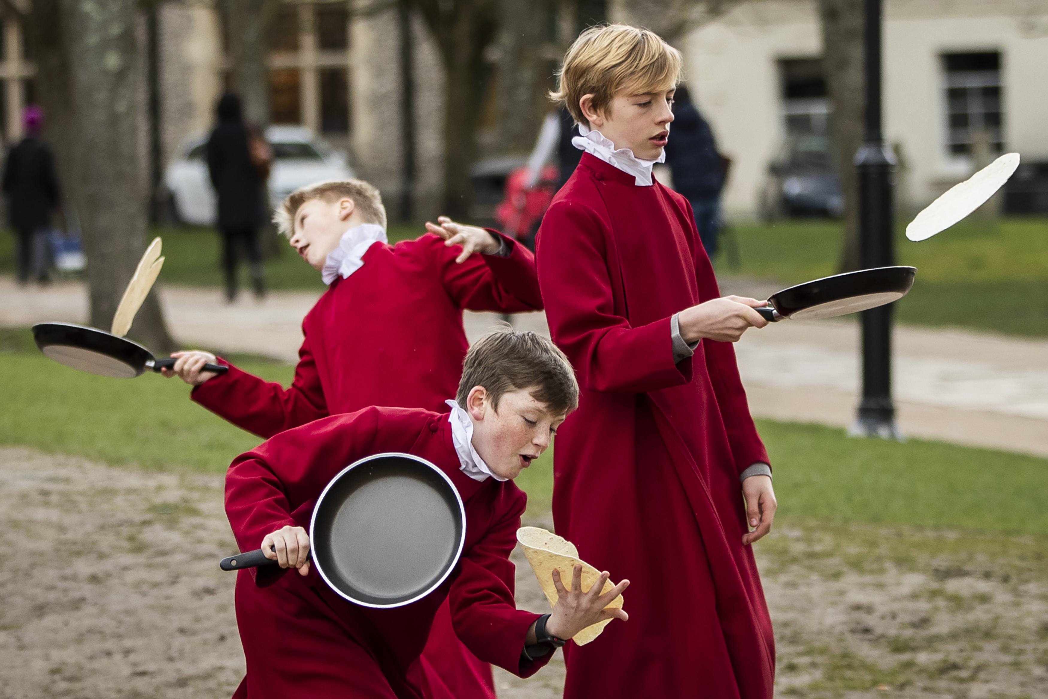 Choristers from Winchester Cathedral joke around in between being posed up for pictures by photographers on March 5, 2019 in Winchester, England. Winchester Cathedral held it's inaugural Shrove Tuesday Pancake day race in the Cathedral grounds today with money raised going to local charities.