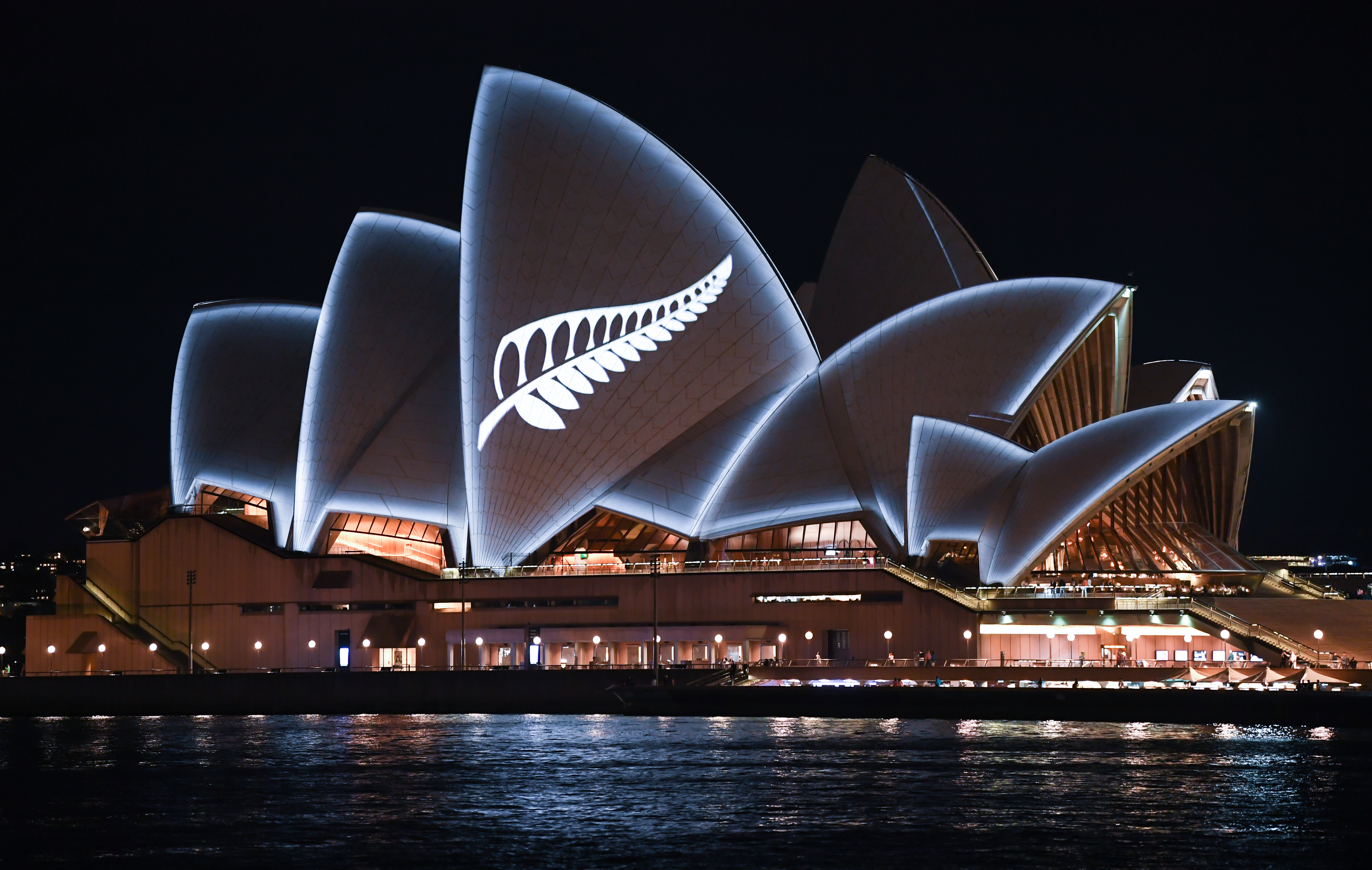 A silver fern is projected onto the sails of Sydney Opera House in commemoration of the victims of the Christchurch massacre