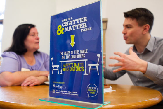 Writer Stevie Gallacher chats with Ann Cameron at cafe’s Chatter and Natter Table