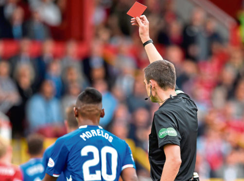Rangers' Alfredo Morelos is shown a red card by Kevin Clancy in August's league match against Aberdeen