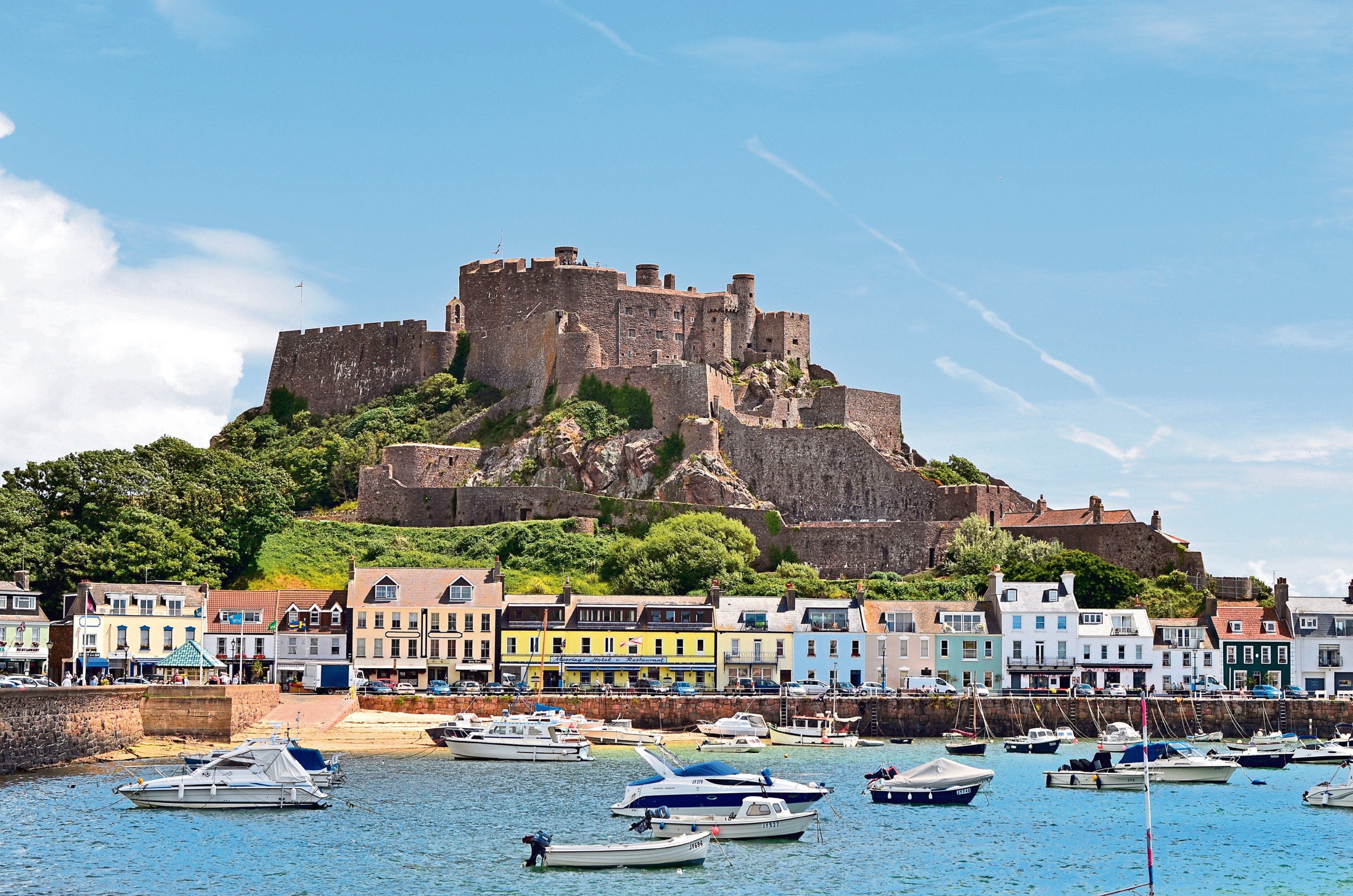 The magnificent Mont Orgueil Castle towers over Gorey Bay on Jersey