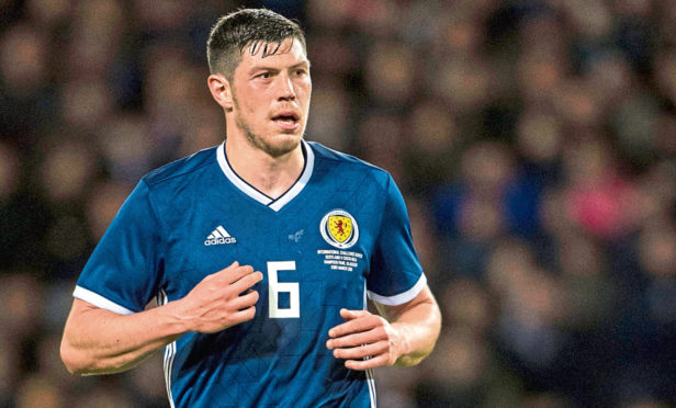 Scott McKenna in action for Scotland