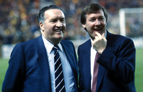 Jock Stein and Alex Ferguson, seen together in 1985, are both in the top 50 of a new list of top managers