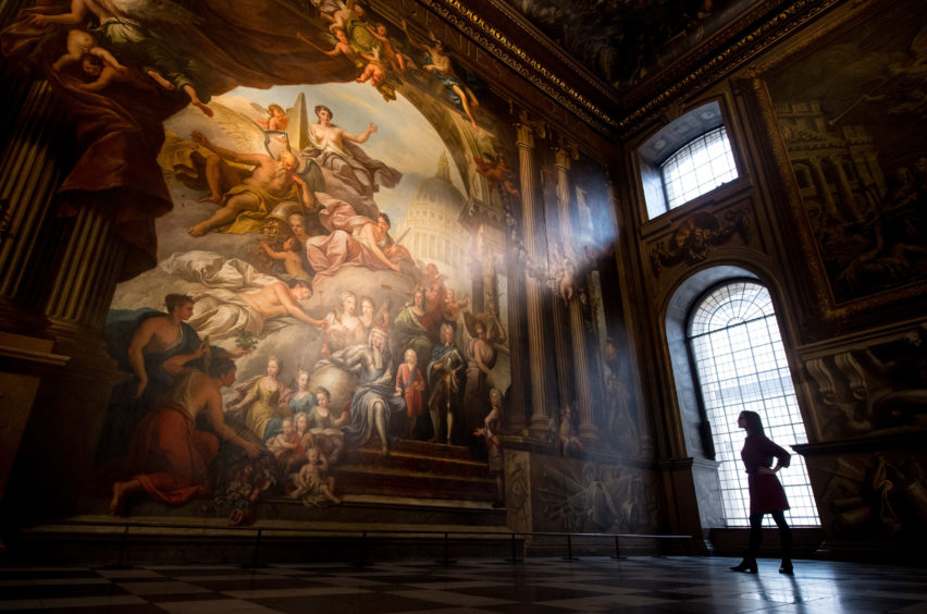 A visitor views Greenwich’s Painted Hall at the Old Royal Naval College in London, following a two-year National Lottery funded conservation project
