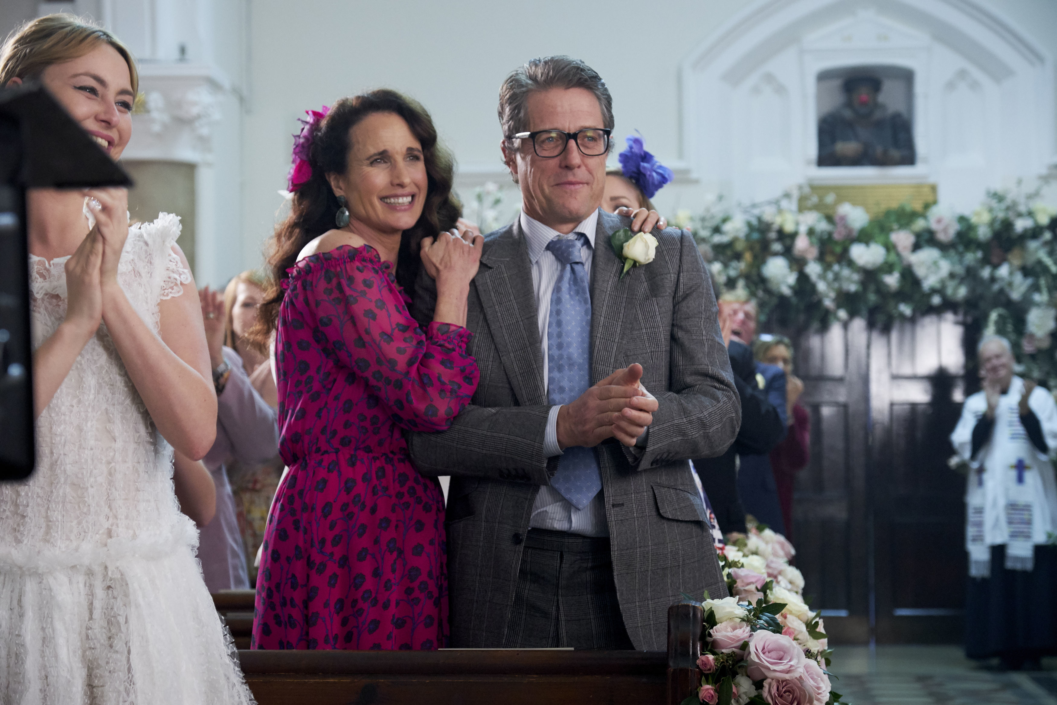 Behind the scenes of Andie Macdowell and Hugh Grant during the filming of One Red Nose Day and a Wedding