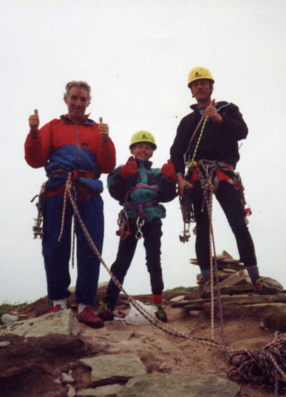 Leo, centre, dad Mark, right, and Ken Tilford summiting the Old Man of Hoy in 1991