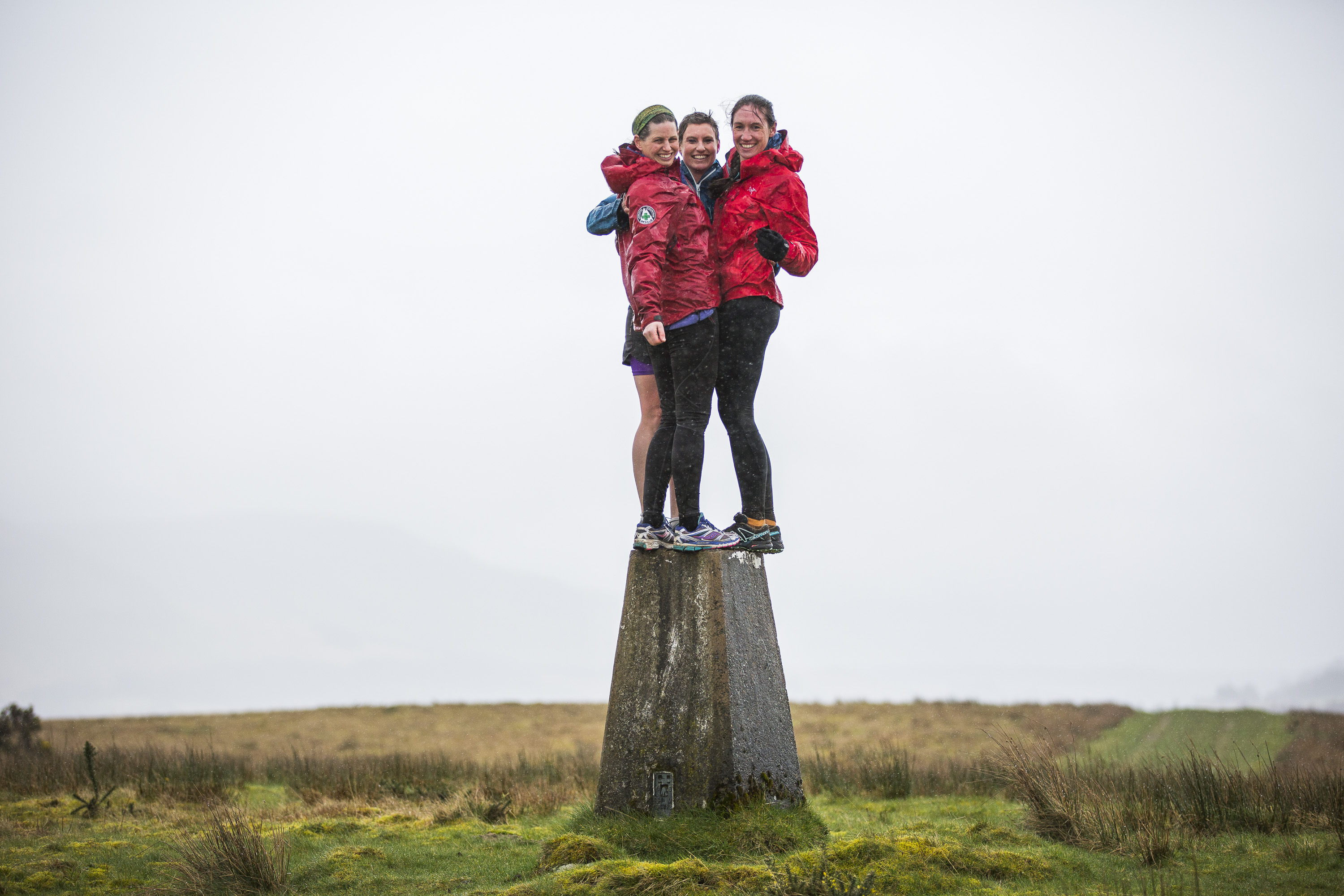 Jamie Aarons, Alex Berry and Jenny Allen who are runners are doing a trig point challenge on 6 April