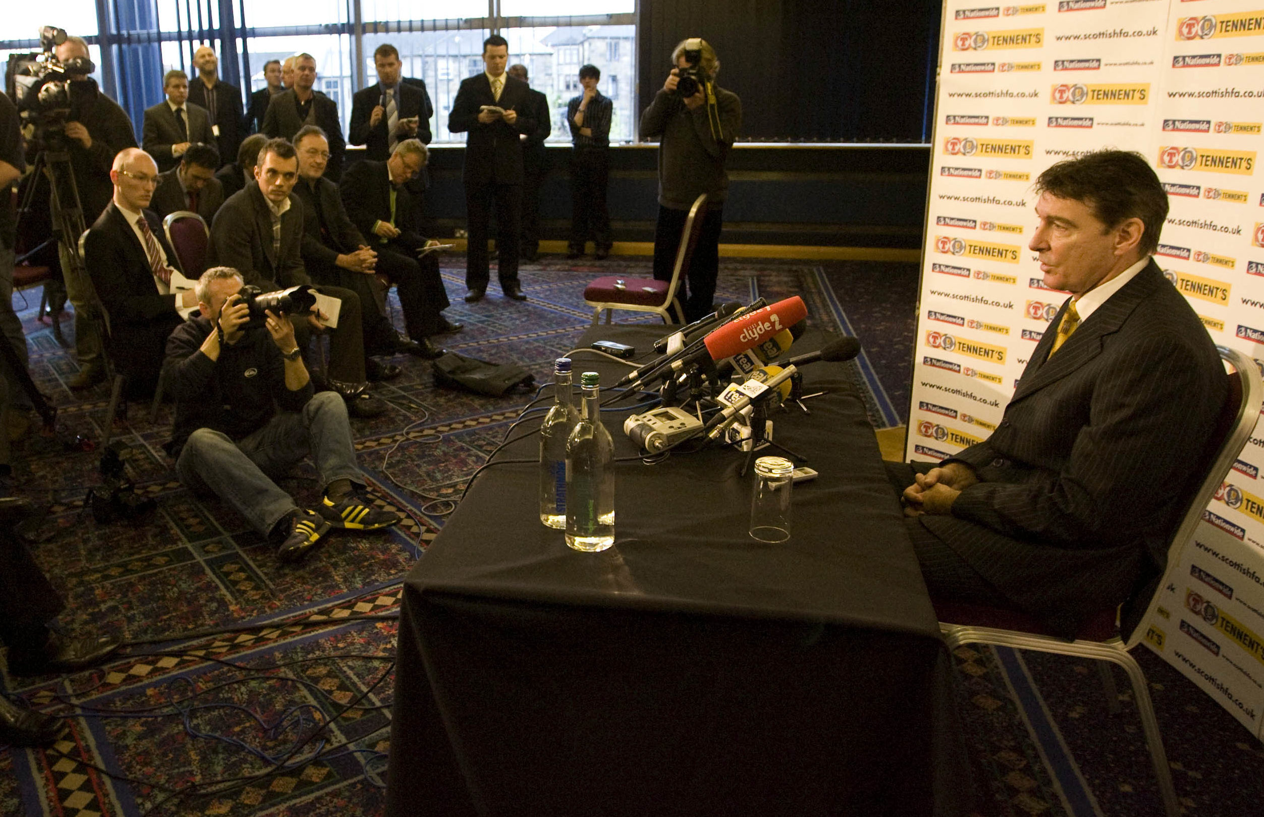 Gordon Smith in front of the media after George Burley was sacked as Scotland boss