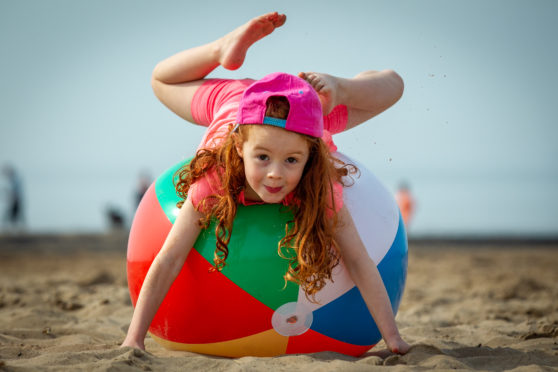 Georgia Blair, four, from Glasgow playing at Troon yesterday