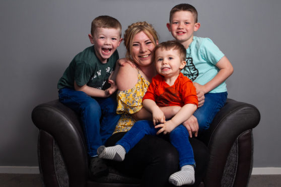 Carol Hunter successfully studied at The Open University, and now has a good job, and she has 3 children to look after. Pic shows her children (L-R): Carson (6), Odynn (2), Jackson (8).  Location: Dunfermline.