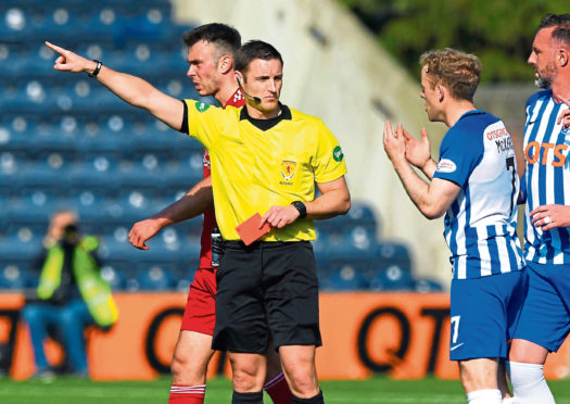 Referee Steven McLean brandishes his third red card to Kilmarnock last weekend