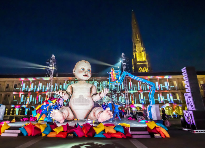 A giant mechanical baby, which stands taller than a double-decker bus and takes nine people to operate, forms the centrepiece of an outdoor theatre production, Zara, at the Piece Hall in Halifax, Yorkshire. The performance puts learning-disabled parents and artists at its heart and tells the story of a mother’s fight for her children