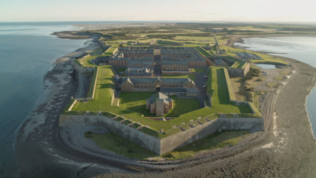 Fort George near Inverness is one of the castles at risk. Historian Jamie Crawford took to the skies in helicopters and light aircraft, top, to see the effects of climate change on Scotland’s coastlines for himself. He says today’s aerial photographs, main and left, show the tide line is much higher than it was in 1941, above, and fears we will soon lose many of our historic sites.