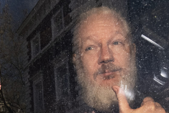 Julian Assange. More than 70 Parliamentarians have signed a letter urging the Government to ensure the WikiLeaks founder faces Swedish authorities if they request his extradition.