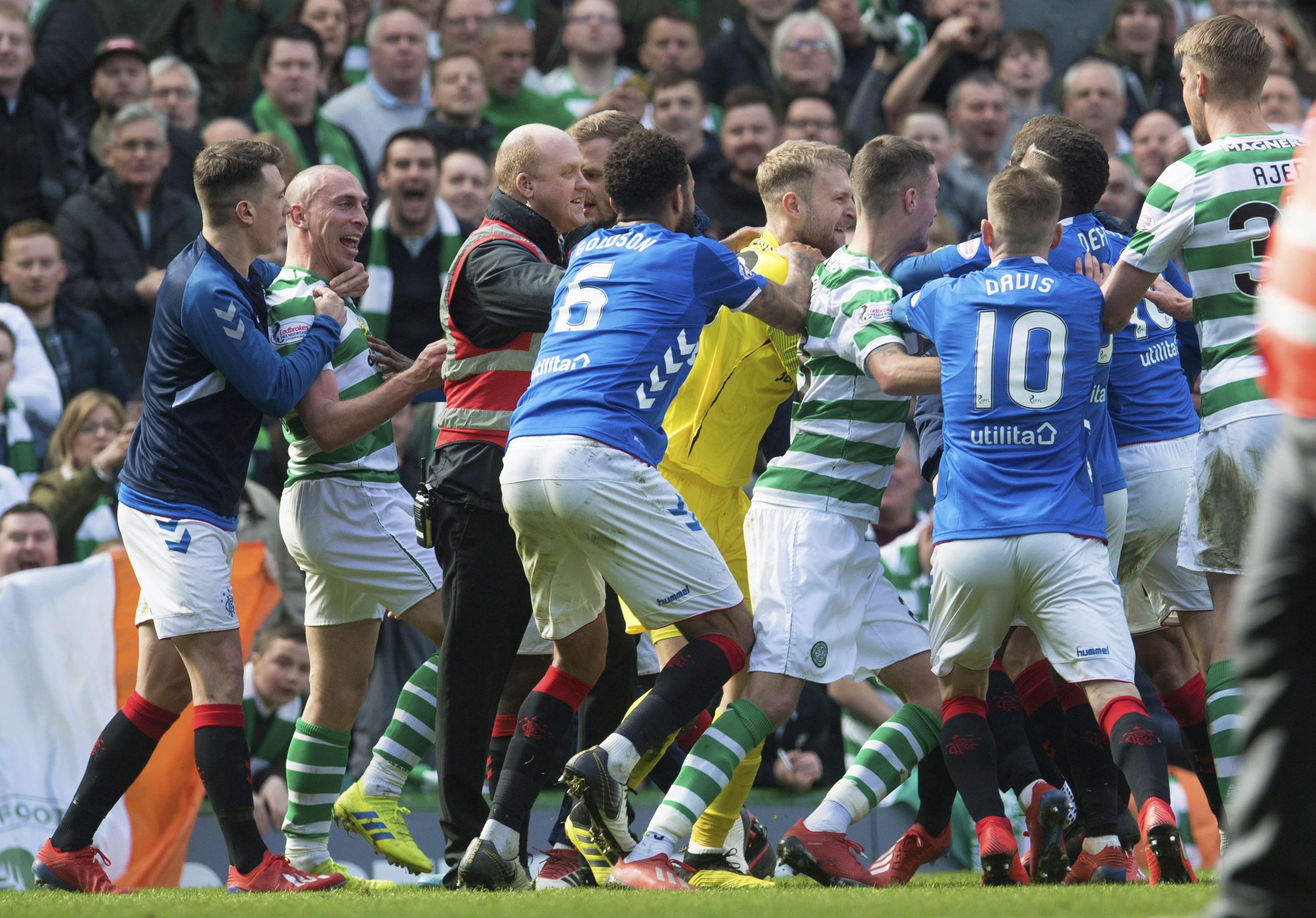 Celtic and Rangers players clash