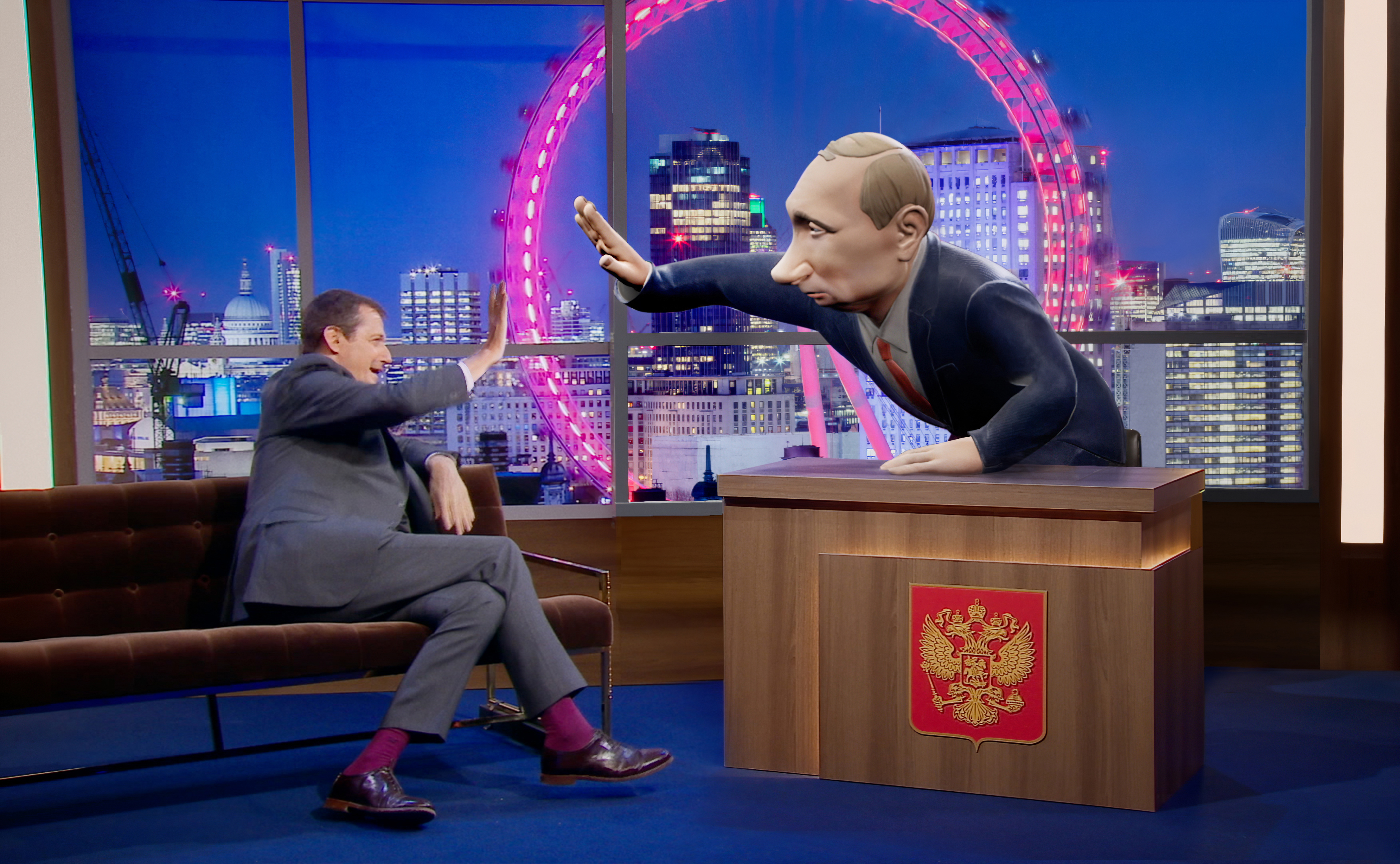 Alistair Campbell speaking to a 3D digital cartoon of Vladimir Putin, who will be the new chat show host