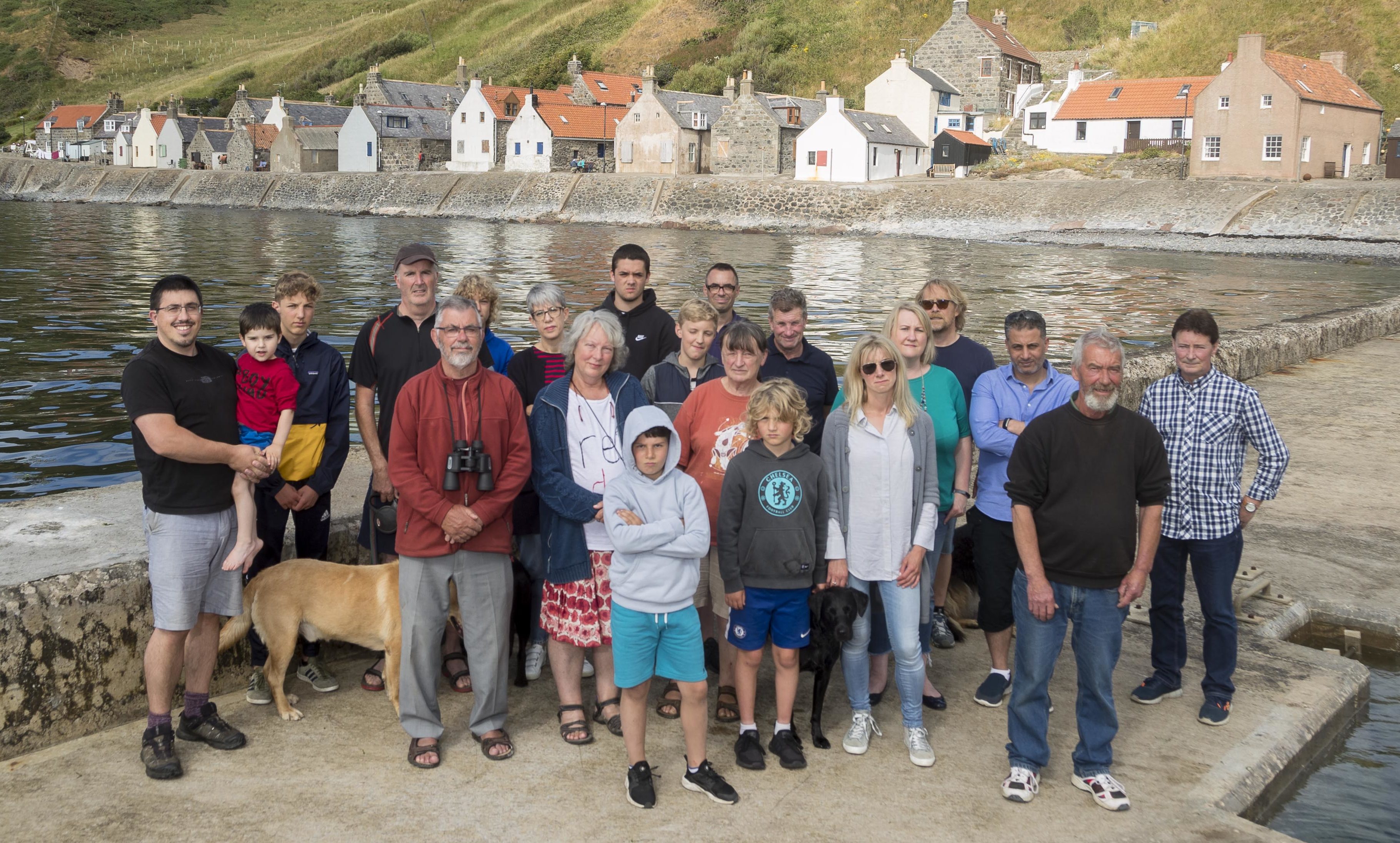 Given the slip? Crovie residents on the village pier