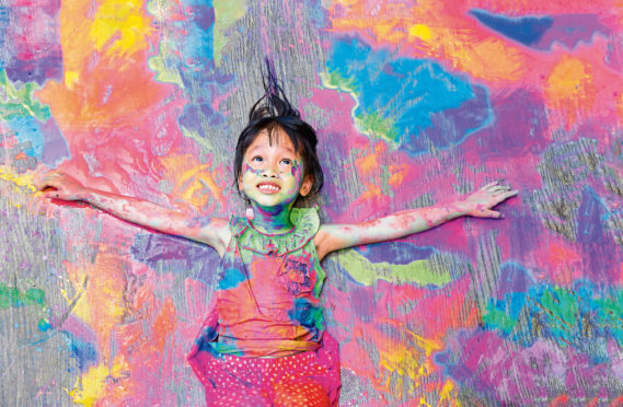 Posed picture of a girl covered in paint. Colours were extracted from everything including bones and even snails