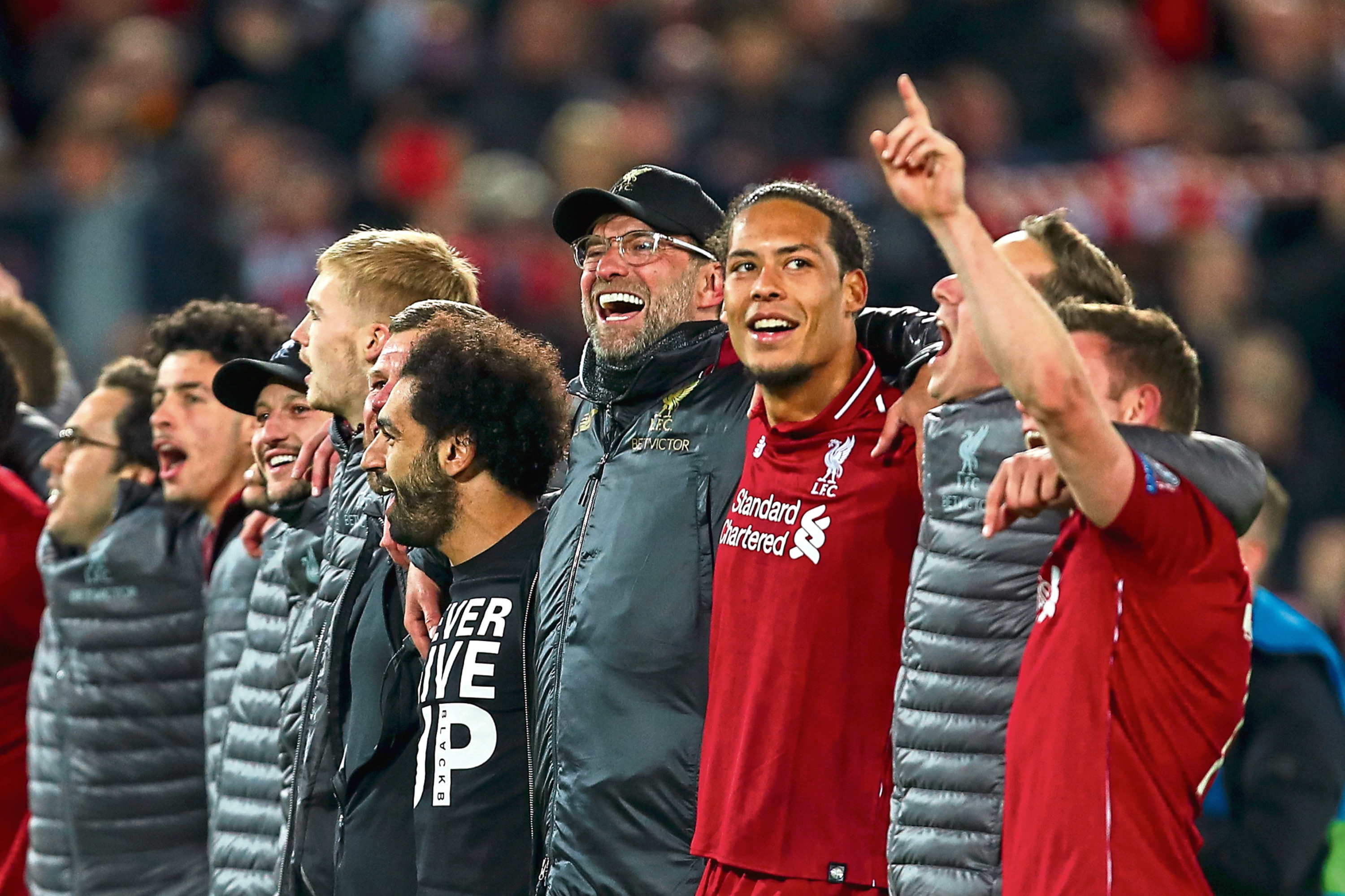 Liverpool boss Jurgen Klopp celebrates with his players and staff