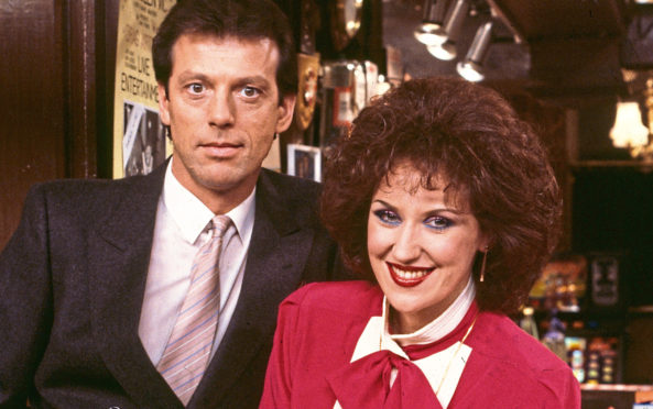 Actors Leslie Grantham and Anita Dobson pictured in the Queen Vic