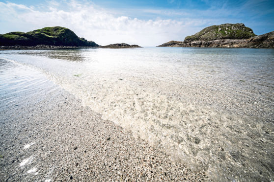 Iona, Scotland - the amazingly clear perfect shallow waters of Port Ban beach and bay.