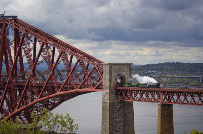 The Flying Scotsman crosses the Forth Bridge on its way from Edinburgh to Inverness