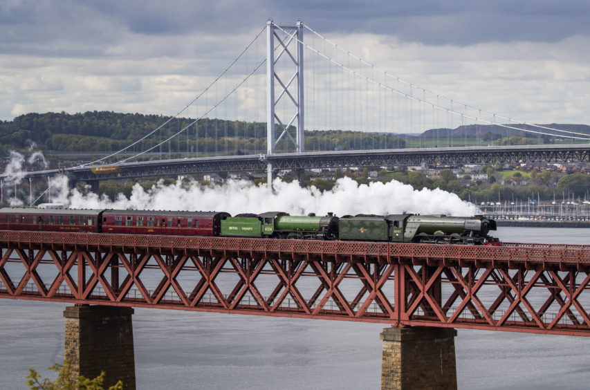 The Flying Scotsman crosses the Forth Bridge on its way from Edinburgh to Inverness