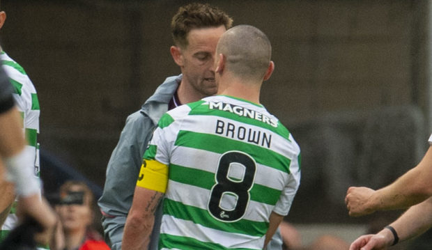 Celtic's Scott Brown (right) clashes with Hearts' Steven MacLean after the full time whistle