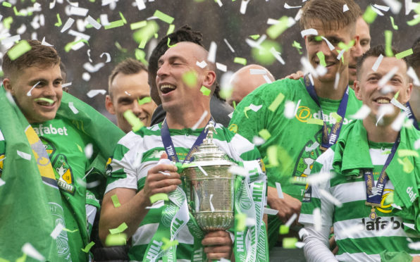 Celtic's Scott Brown celebrates winning the William Hill Scottish Cup