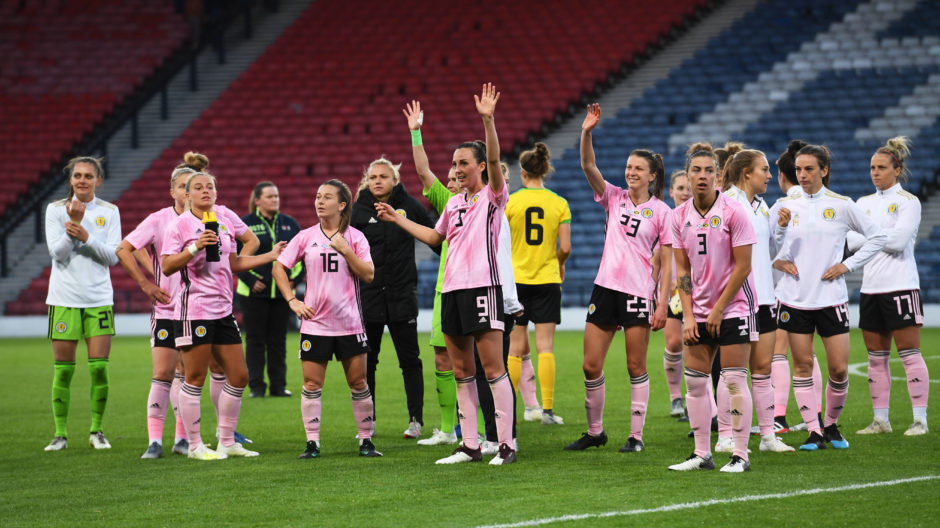 Scotland players wave to the fans at full-time