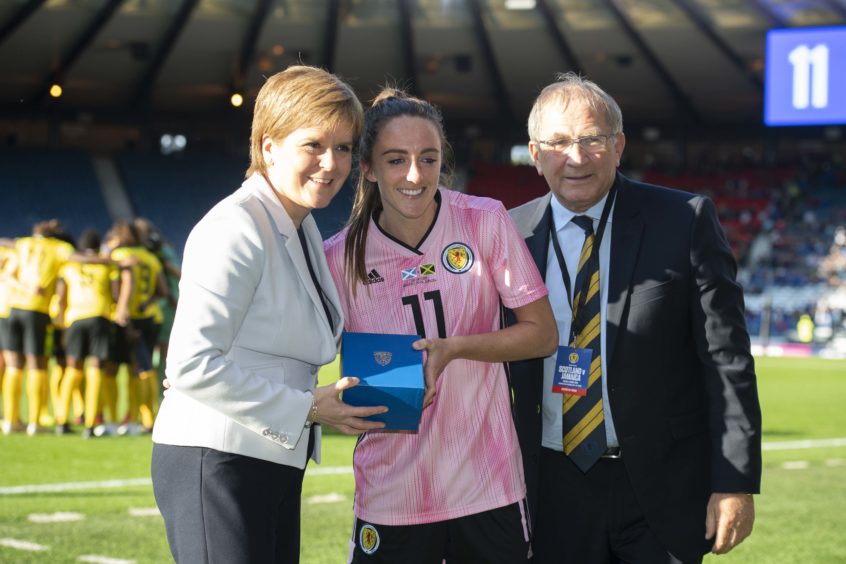 Scotland's Lisa Evans is presented with her 75th cap by First Minister Nicola Sturgeon and SFA President Alan McRae
