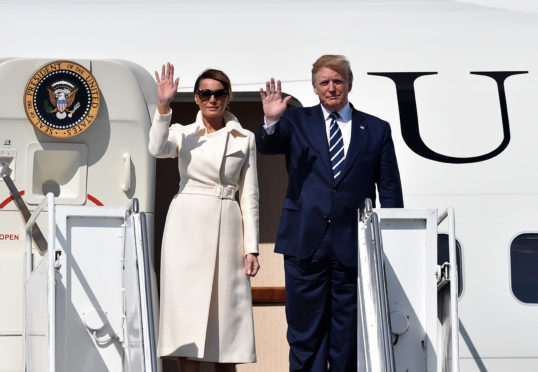 President Donald Trump disembarks Air Force One alongside First Lady Melania Trump after arriving at Shannon airport on June 5, 2019 in Shannon, Ireland. President Trump will use his Trump International golf resort in nearby Doonbeg as a base for his three day stay in Ireland. The resort employs over 300 local people in the area and the village will roll out a warm welcome for the 45th President of the United States.