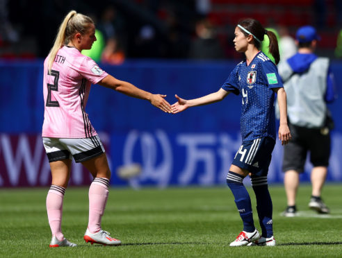 Kirsty Smith of Scotland shakes hands with Yui Hasegawa of Japan after the match