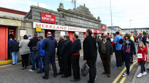 Aberdeen fans queue to get into Pittodrie, something that needs to continue around the country for the good of the game overall