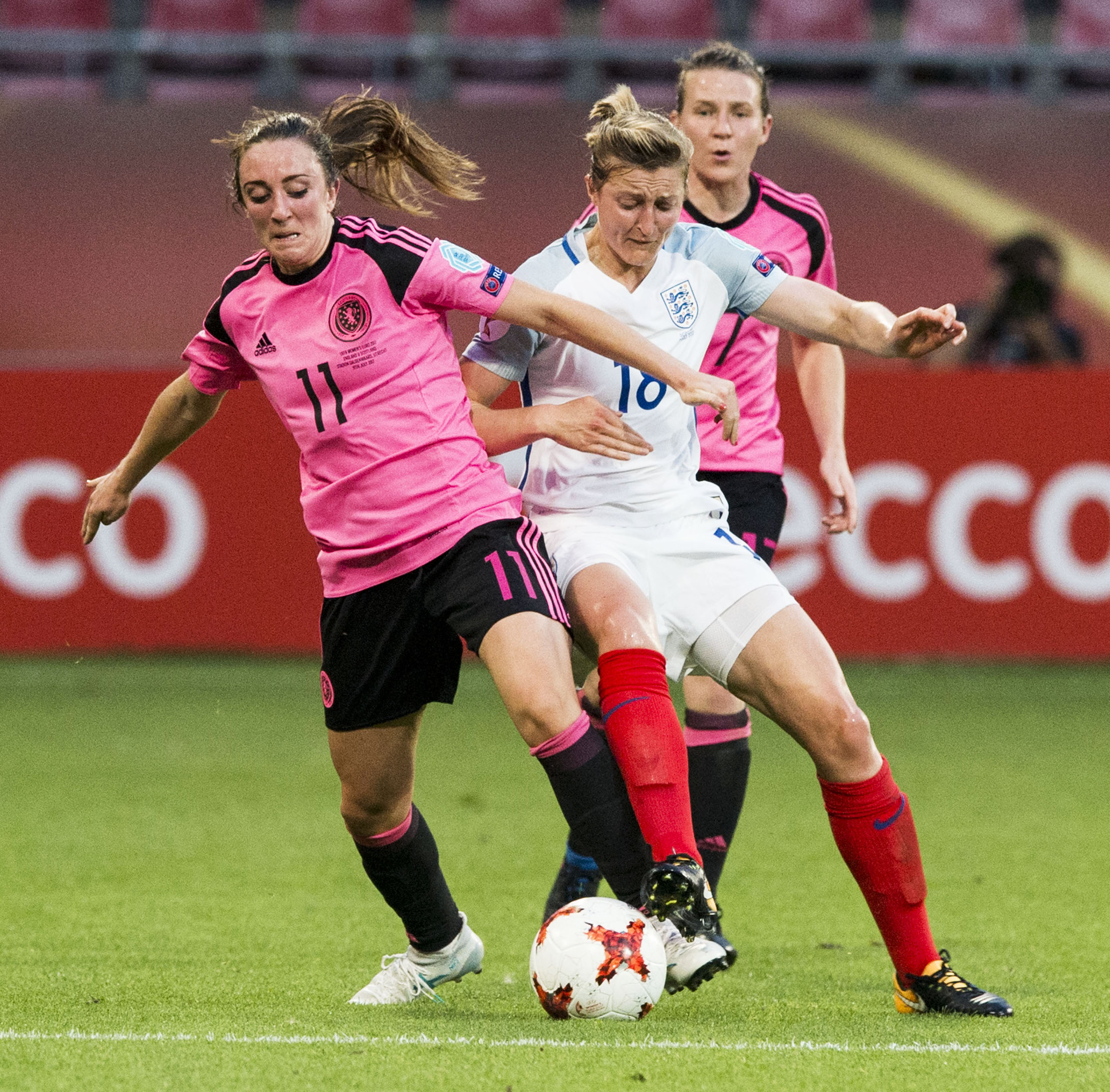 Scotland's Lisa Evans (left) holds off England's Ellen White