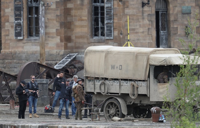 The shoot includes vehicles