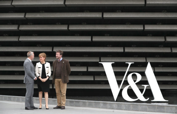 First Minister Nicola Sturgeon with director Philip Long (left) and trustee of the Postcode Culture Charles Dundas during a visit to the V&A  in Dundee