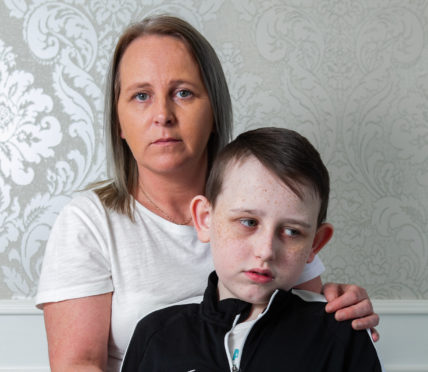 Josie Morgan and son Tommi, a Buchanan High pupil who wants to know why he suddenly became blind