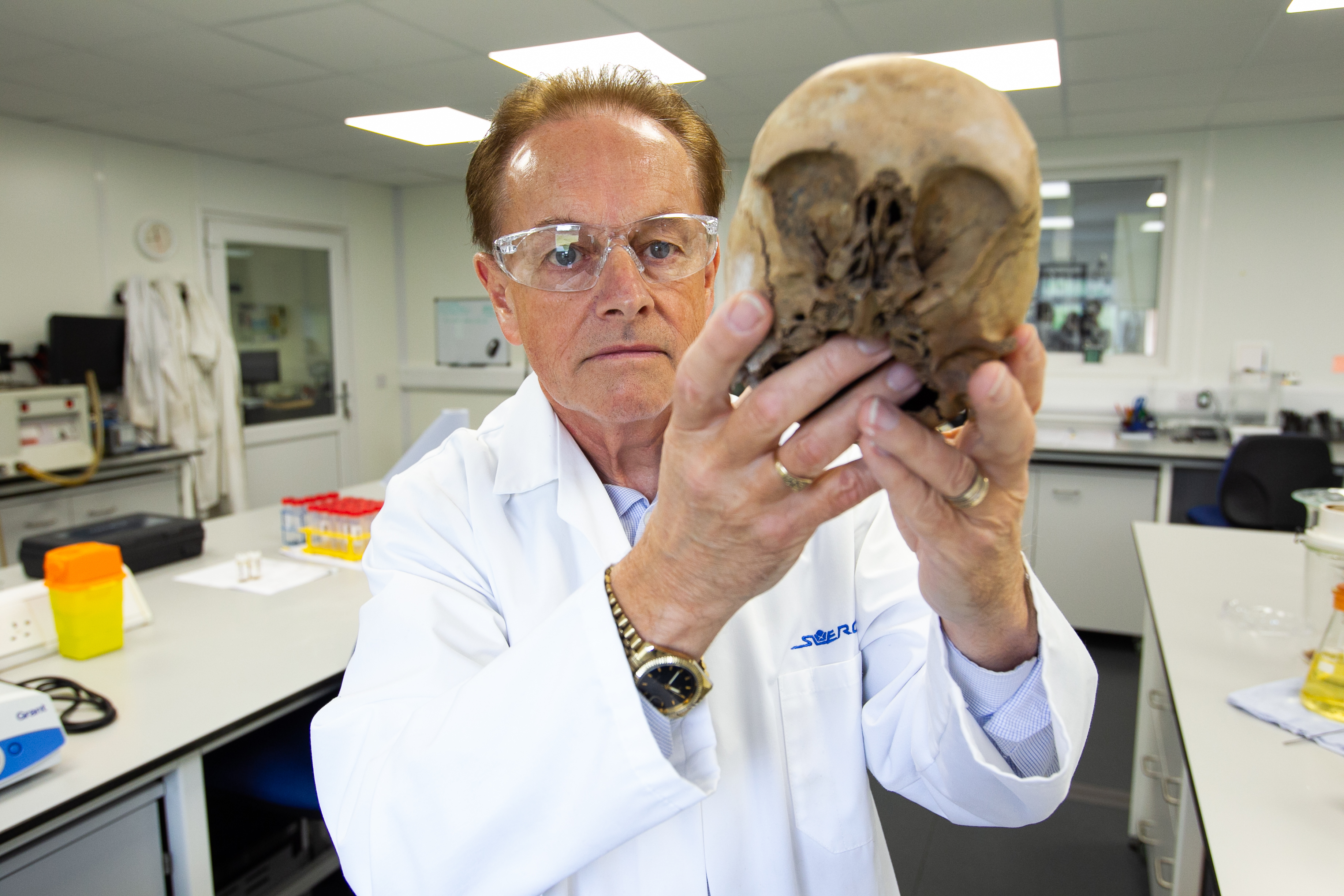 Professor Gordon Cooke, who is a Forensic Anthropologist, who has solved crimes through examining bones. Pic shows him holding a skull which the lab has done tests on. Location Scottish Universities Environmental Research Centre, East Kilbride.