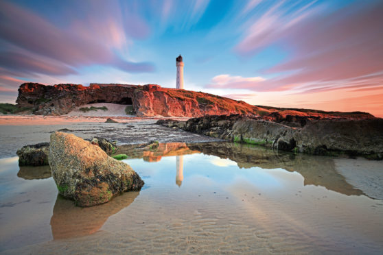 The lighthouse at Lossiemouth on the Moray Firth at sunset