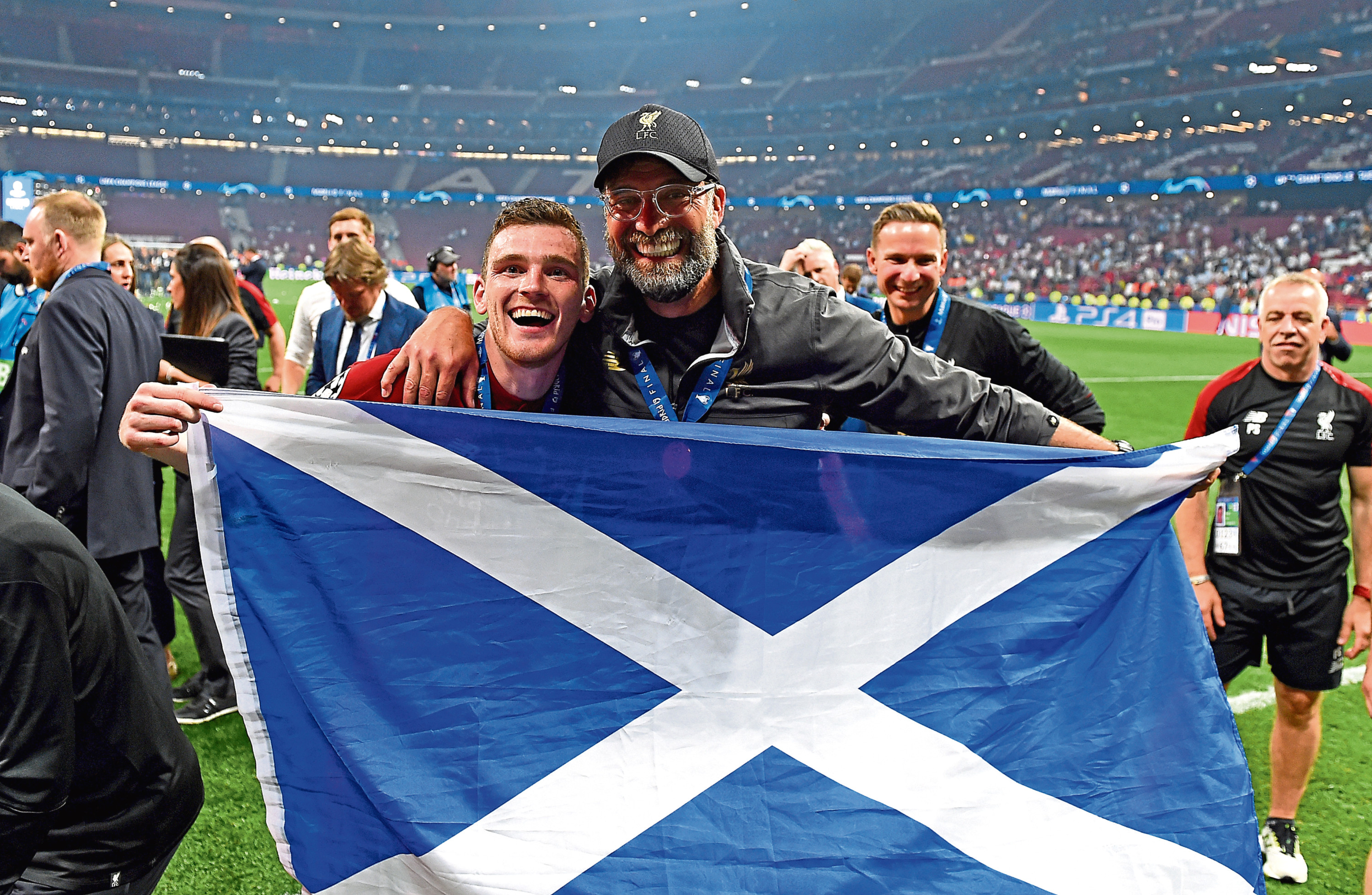 Andy Robertson celebrates winning the Champions League with boss Jurgen Klopp