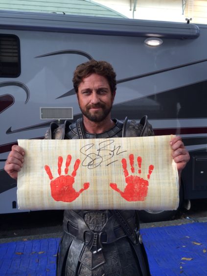 Gerard Butler with his handprints