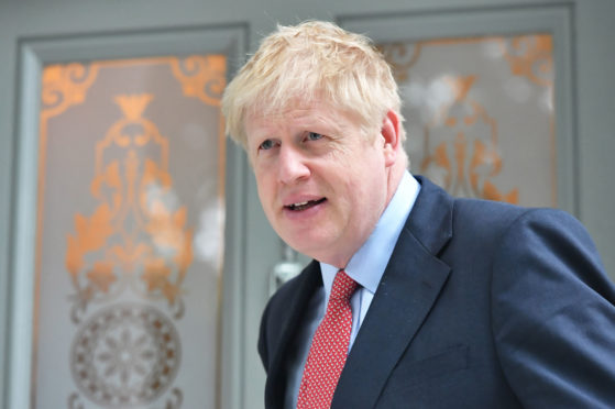 Conservative party leadership contender Boris Johnson leaving his home in south London.