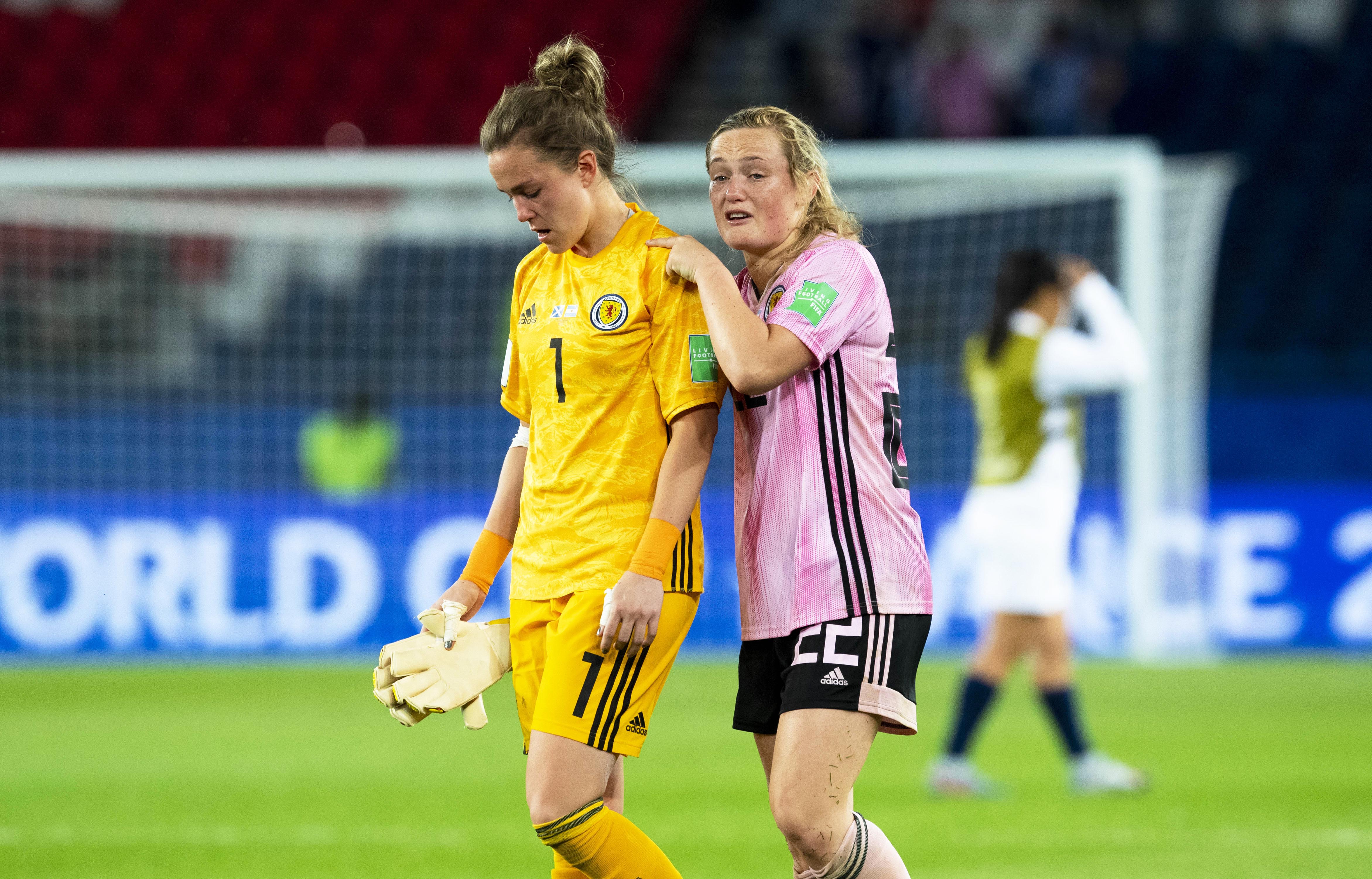 Scotland's Lee Alexander (L) and Erin Cuthbert looking dejected at full-time as they crash out of the World Cup