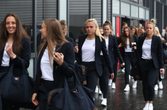 Scotland's Rachel Corsie (centre) arrives at Edinburgh Airport as the Scotland Women's team depart for the Women's World Cup in France.