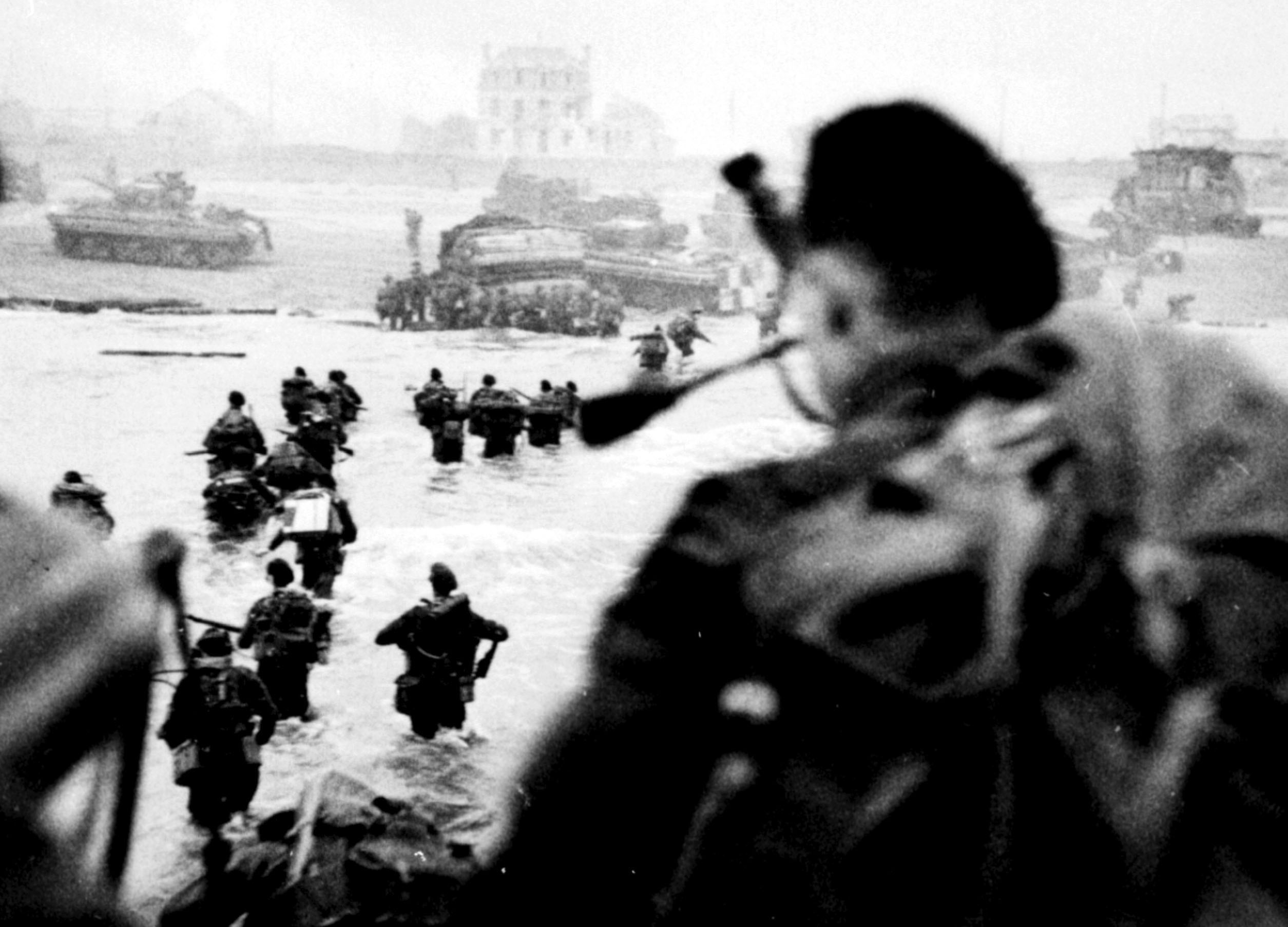 Allied troops charge ashore along stretch of Normandy coast on D-Day