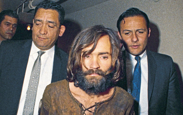 Charles Manson is taken to court in Los Angeles after 1969 murders