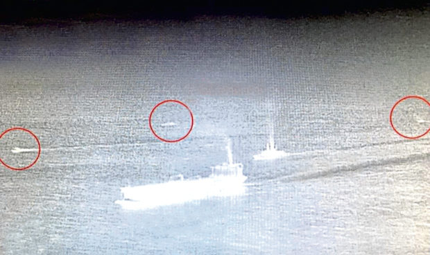 The Ministry of Defence released this photo of HMS Montrose warding off Iranian Revolutionary Guard speedboats (circled) which harassed the UK-flagged tanker British Heritage on July 10. It comes after critics questioned why last night's oil tankers were not escorted by warships amid ongoing tensions with Iran