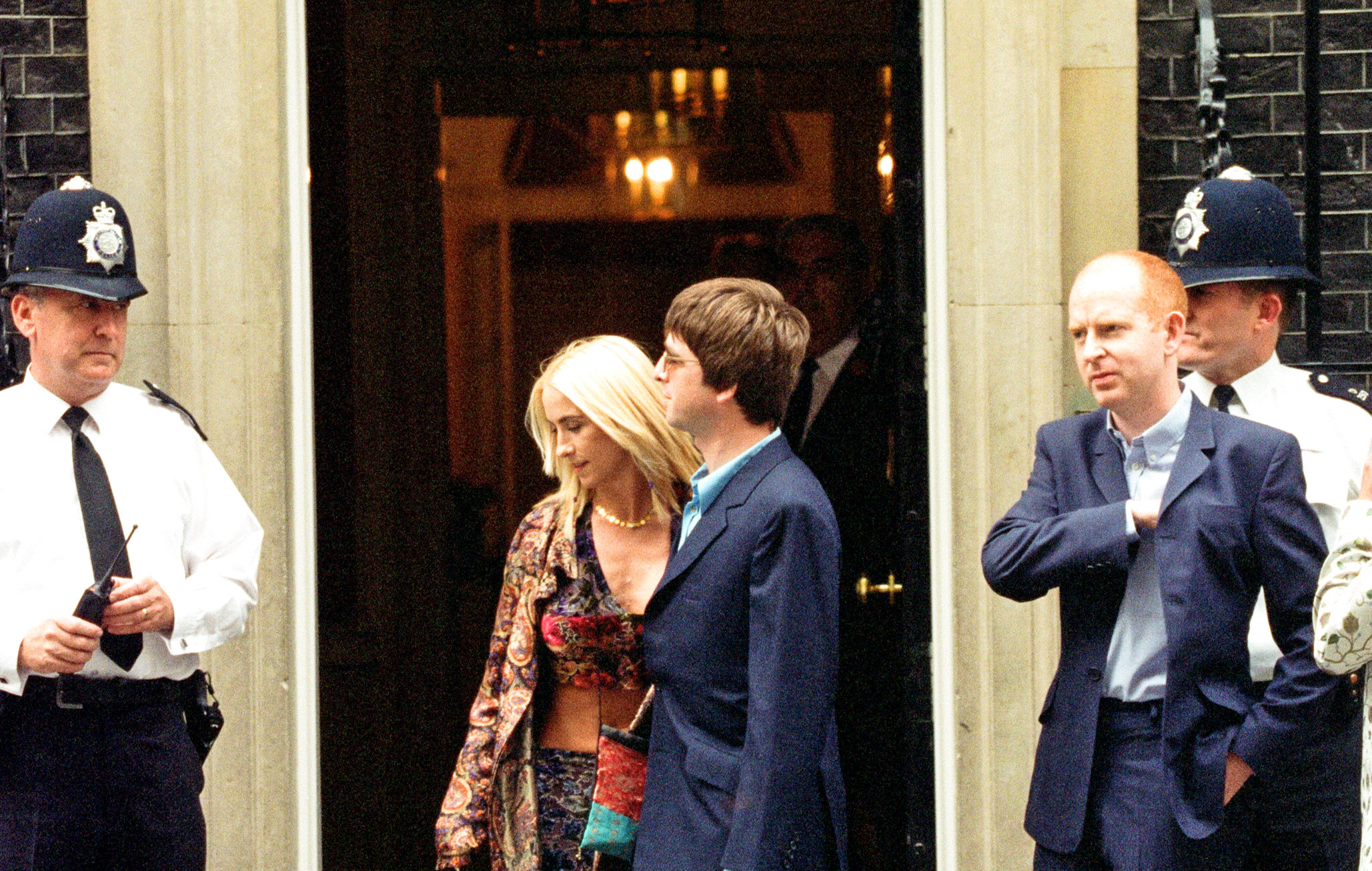 Alan McGee, on right, with Noel Gallagher and Meg Matthews arriving in Downing Street on July 30, 1997